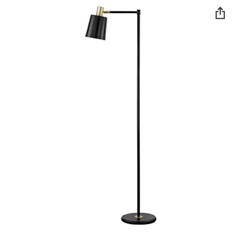 Globe lamp. Black and gold in colour. Concrete in base so it stands straight.